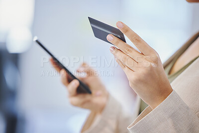 Buy stock photo Cropped shot of a businesswoman using her cellphone and a credit card