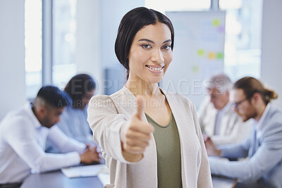Buy stock photo Shot of a beautiful young businesswoman showing thumbs up while standing in the boardroom