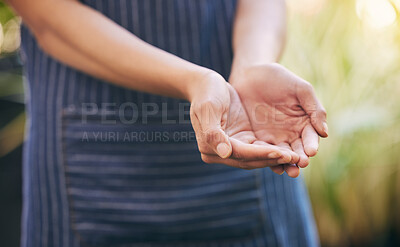Buy stock photo Shot of a florist with her hands open ready to receive