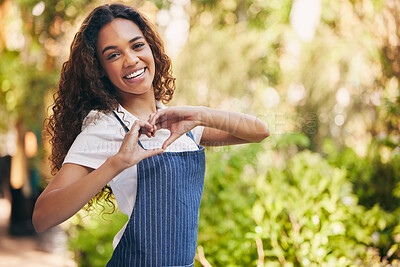 Buy stock photo Heart hands, portrait and a woman with love at a nursery, garden job or sustainable small business. Happy, care and a florist with a shape gesture or emoji for nature, plants and flowers in a park