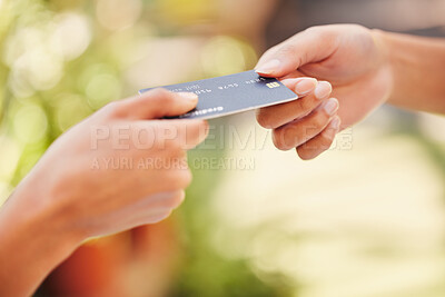 Buy stock photo Shot of a customer using a card to make a payment