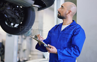 Buy stock photo Man, mechanical engineer and writing with clipboard for service, checklist or report on vehicle repair at workshop. Male person or mechanic with notes for car inspection, maintenance or fix at garage