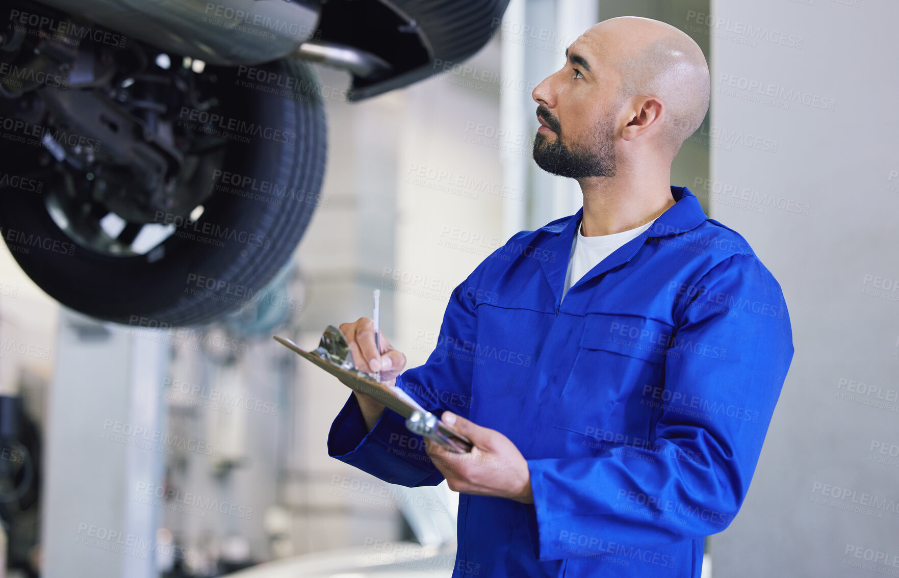 Buy stock photo Man, mechanical engineer and writing with clipboard for service, checklist or report on vehicle repair at workshop. Male person or mechanic with notes for car inspection, maintenance or fix at garage