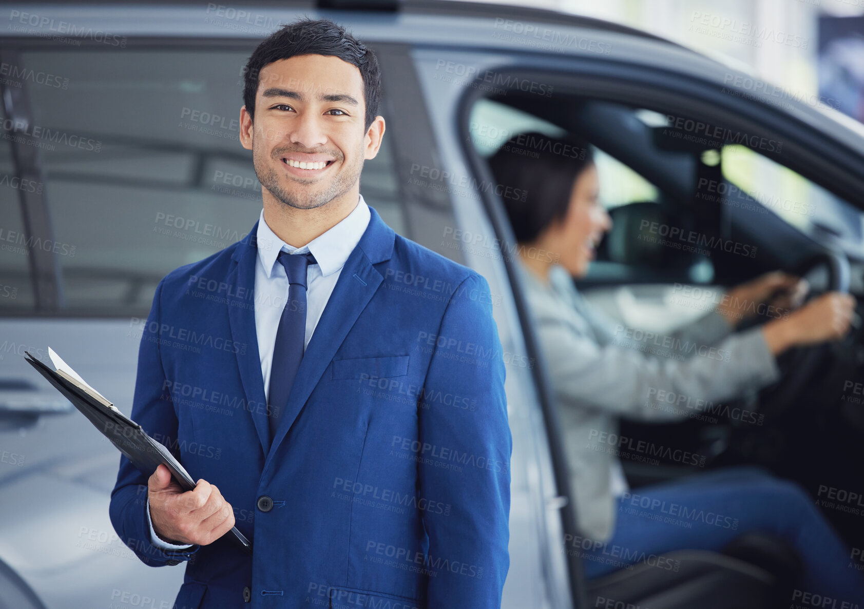Buy stock photo Documents, portrait and car salesman smile at showroom, workshop or workplace. Face, clipboard and Asian person at dealership for motor vehicle shopping, business and sales manager in retail store.