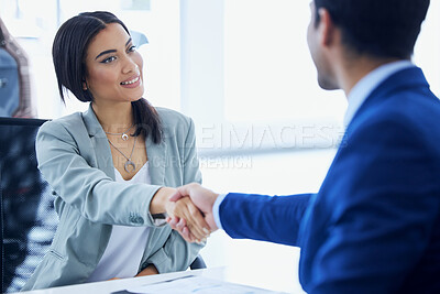 Buy stock photo Cropped shot of an attractive young woman and an unrecognizable male car salesman shaking hands in his office