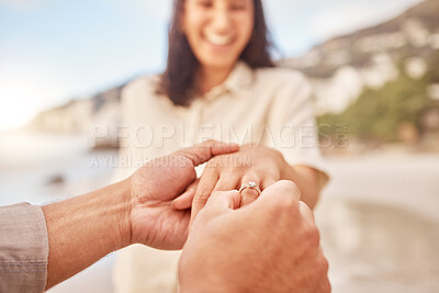 Buy stock photo Pov, engagement and woman with ring on hand at beach with smile, love and happy couple vacation. Man, woman and jewelry with marriage offer by ocean with diamond, excited face or together on holiday
