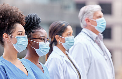 Buy stock photo City, healthcare and doctors with mask for teamwork, collaboration and support for clinic staff. Hospital, nursing and men and women in row for medical care, service and wellness in pandemic safety