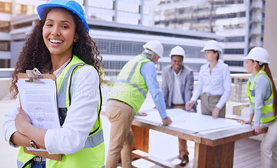 Buy stock photo Woman, portrait and engineer with team, planning and smile for building with clipboard. Architect, construction and safety helmet for collaboration, teamwork and affirmative action in industrial job