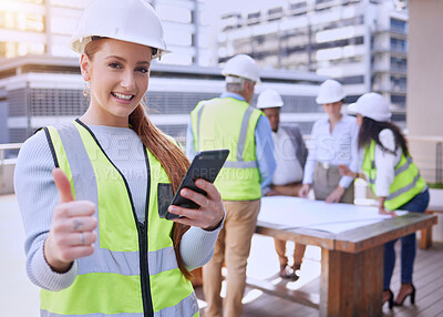 Buy stock photo Woman, portrait and construction with thumbs up, cellphone and smile for building with team. Architect, engineer and safety helmet for collaboration, teamwork and affirmative action in industrial job