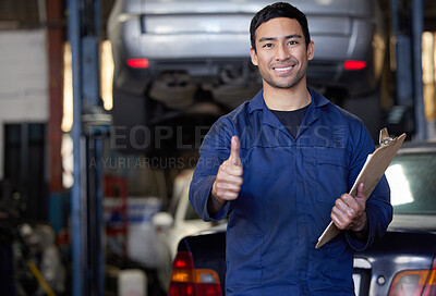 Buy stock photo Man, mechanic and thumbs up in workshop portrait, repair garage and automotive engineering for car maintenance. Good job, vehicle service and motor issues, confident employee and car lift for tuning 