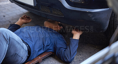 Buy stock photo Man, mechanic and car maintenance with creeper for working on engine in garage for vehicle repairs. Male person, technician and motor inspection for road validation routine checkup in workshop