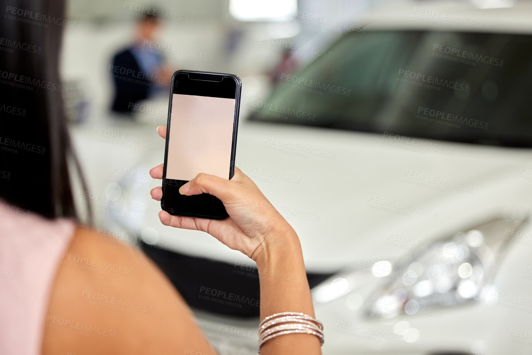 Buy stock photo Hand, phone screen and photograph with customer in car dealership for browsing or purchase as customer. Commerce, retail and shopping with person in showroom for choice, decision or selection