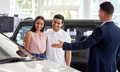 Buy stock photo Couple at car dealership, choice and transportation with salesman, customer buying new transport with luxury. Sales, agreement and show cars with people at automobile showroom with purchase decision