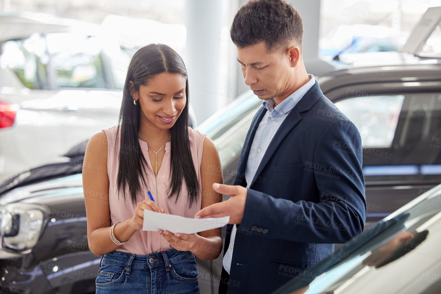 Buy stock photo Woman, car showroom and salesman with documents in discussion for and automobile, service and sale. Agent, person and man with paperwork in store for motor vehicle, agreement or signature of contract