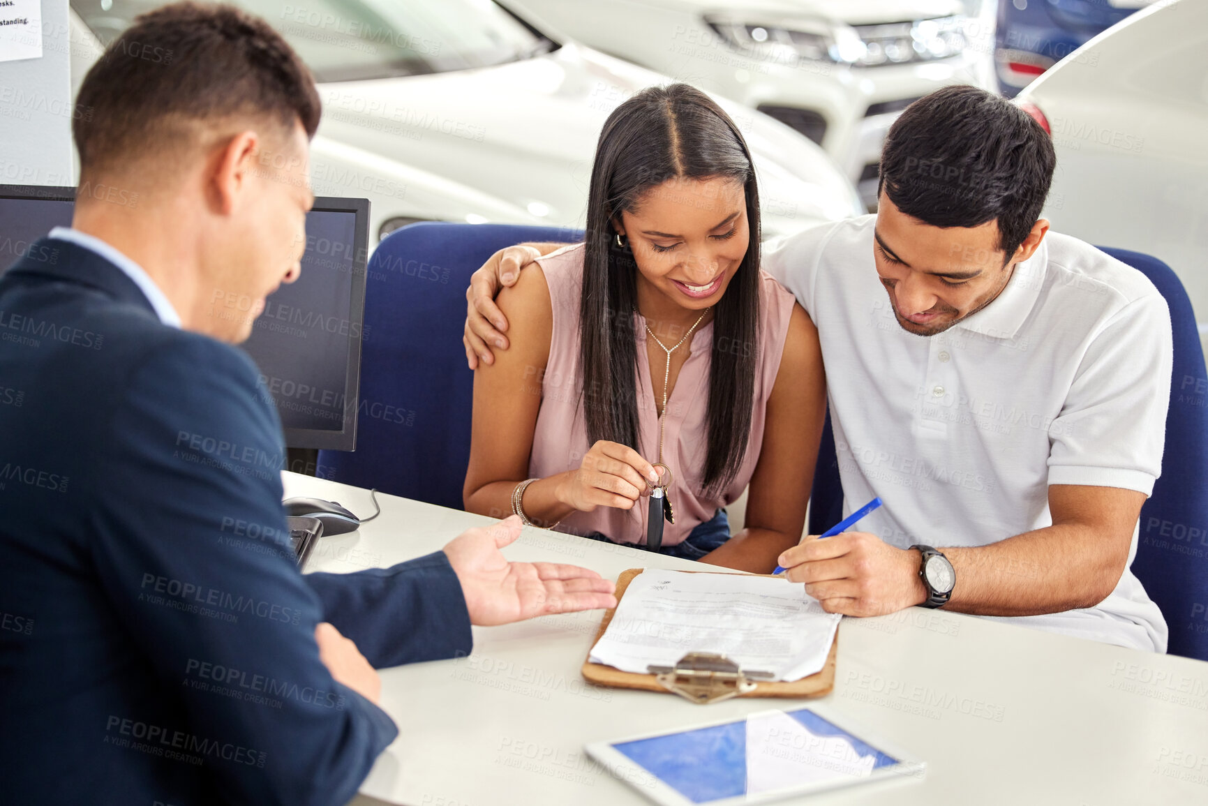 Buy stock photo Car dealership, agent and couple with clipboard in discussion and motor vehicle, sale and contract. Happy, man and woman with legal documents in showroom for automobile, agreement and signature