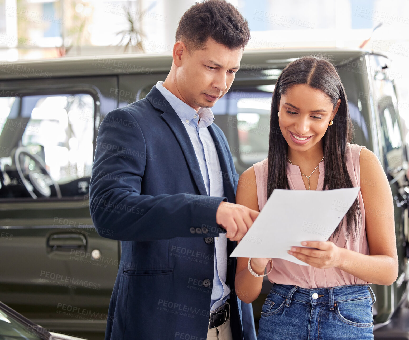 Buy stock photo Woman, car dealership and salesman with documents in discussion for and automobile, sale and service. Happy, person and man with paperwork in showroom for motor vehicle, agreement or contract details