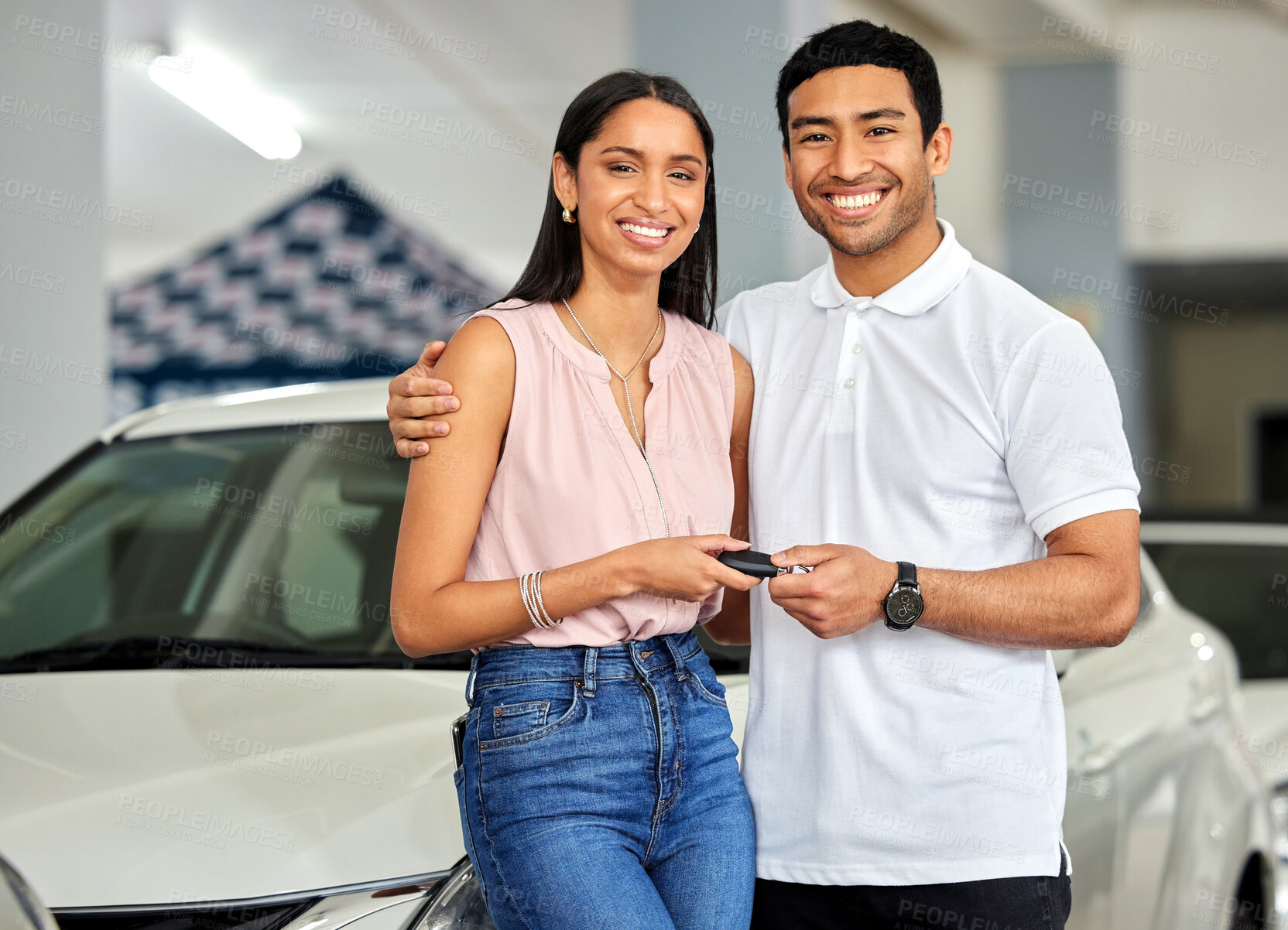 Buy stock photo Couple at car dealership, choice and transport with key, people buy new vehicle with luxury and smile in portrait. Happy with decision, man and woman at automobile showroom with purchase and cars