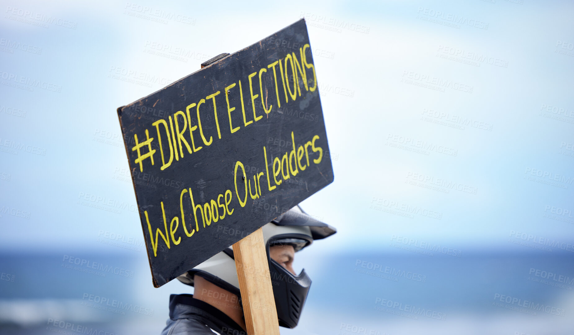 Buy stock photo Shot of an unrecognizable man protesting against the elections