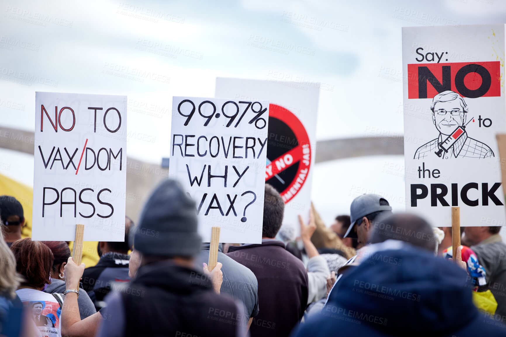 Buy stock photo Unrecognisable demonstrators holding up signs and protesting against the Covid 19 vaccine