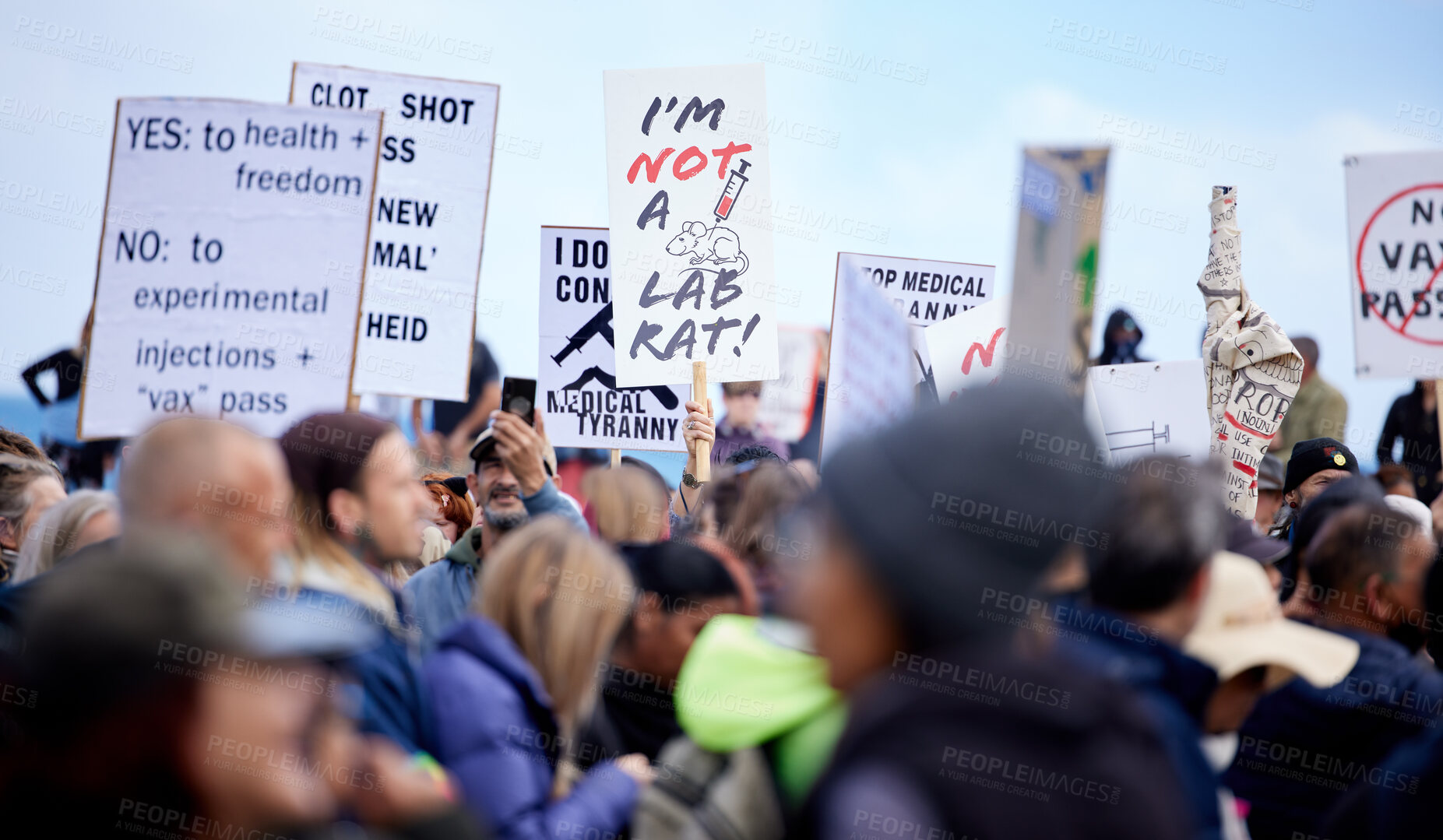 Buy stock photo Crowd, people and protest with sign for vaccine corruption, solidarity and human rights in medical research. Law, change and activism in street with poster, fight and freedom of choice in medicine.