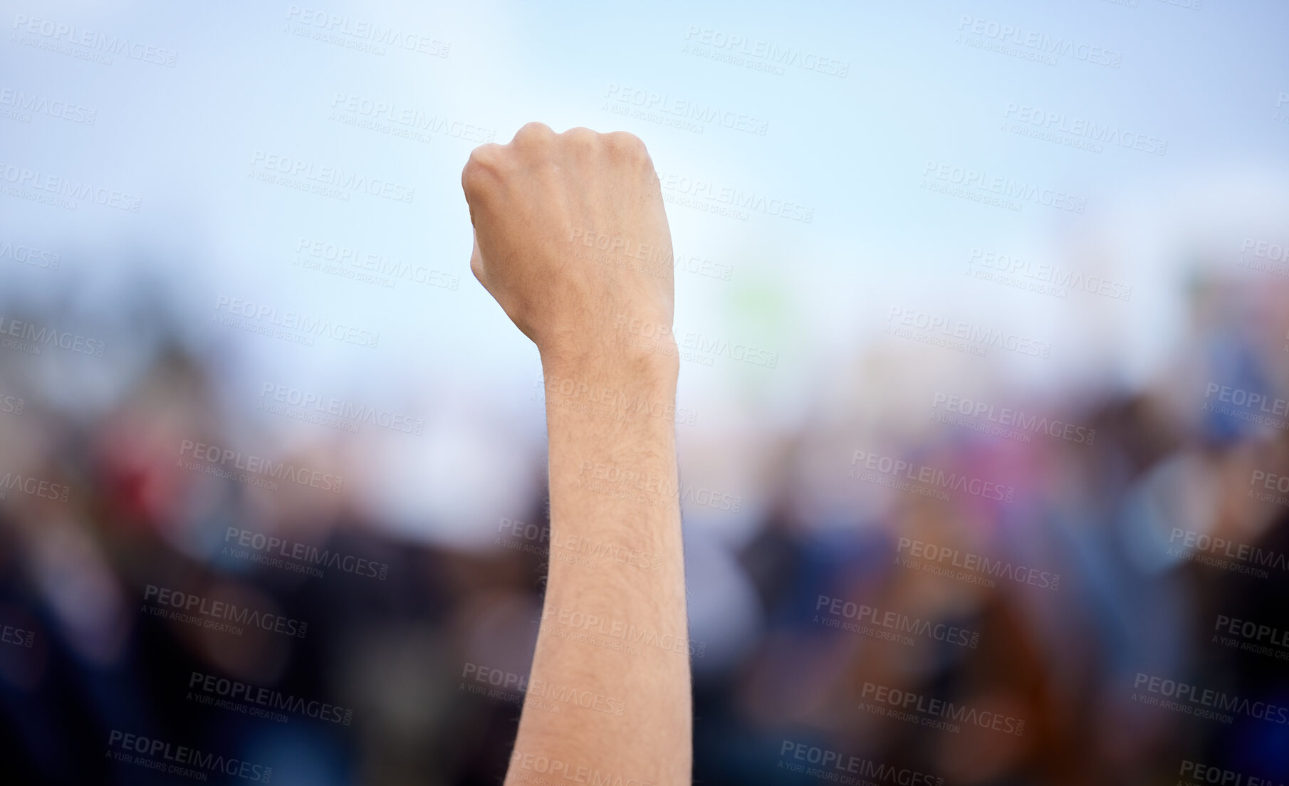 Buy stock photo Unrecognisable demonstrators holding up their fists in protest