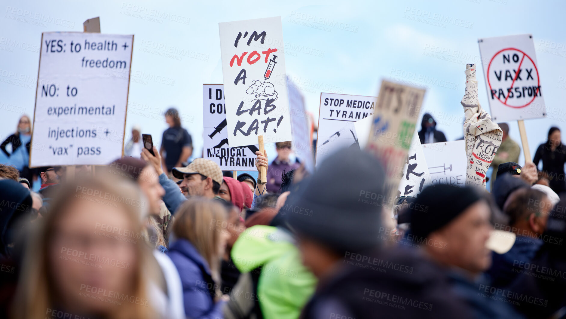 Buy stock photo Group, people and protest with sign for vaccine corruption, solidarity and human rights in medical research. Law, change and crowd in street with poster, fight and freedom of choice with activism.