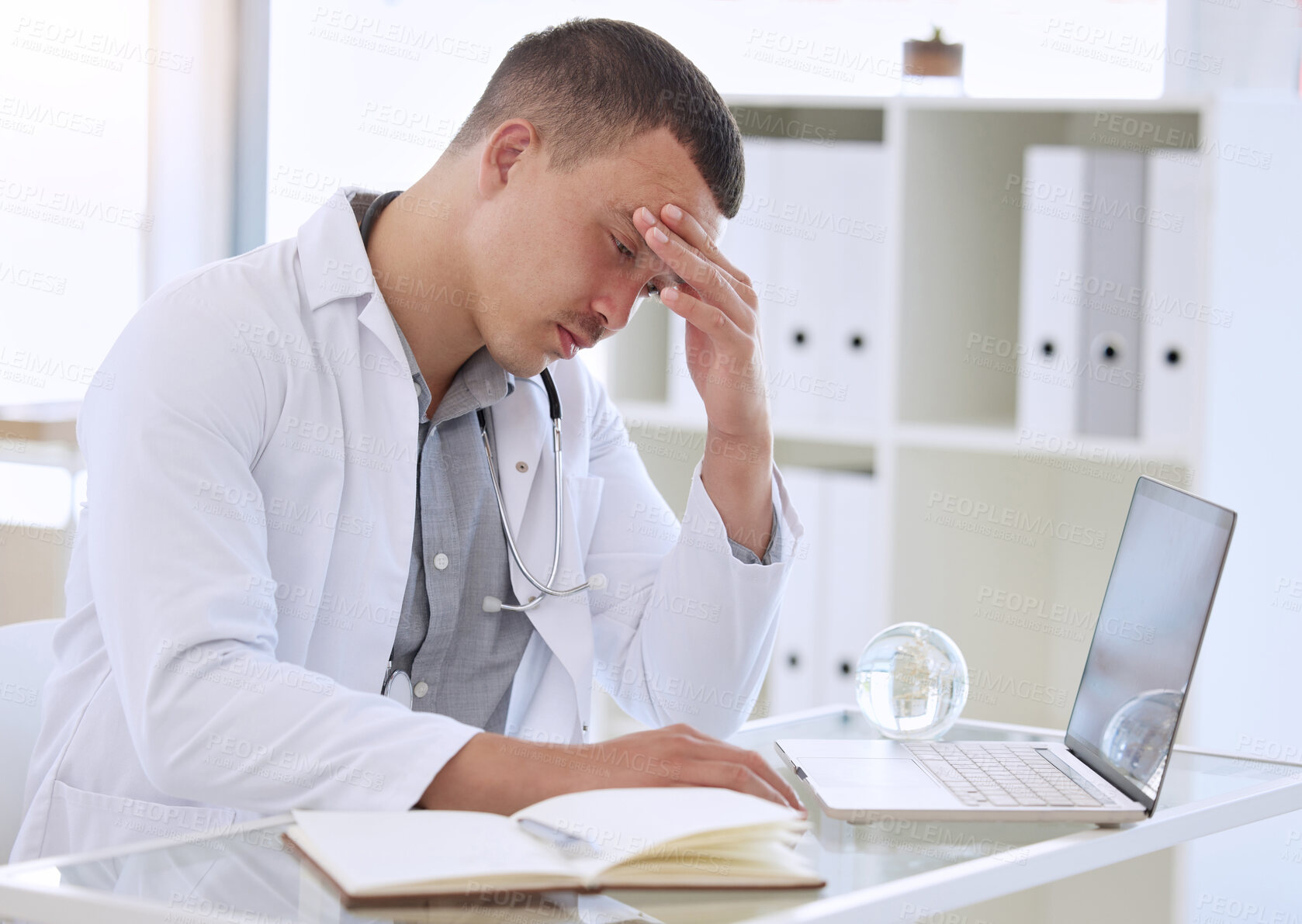 Buy stock photo Laptop, doctor and man with headache, burnout and stress with crisis, overworked and exhausted. Person, medical and professional with pc, tired and physician with migraine, frustrated and fatigue