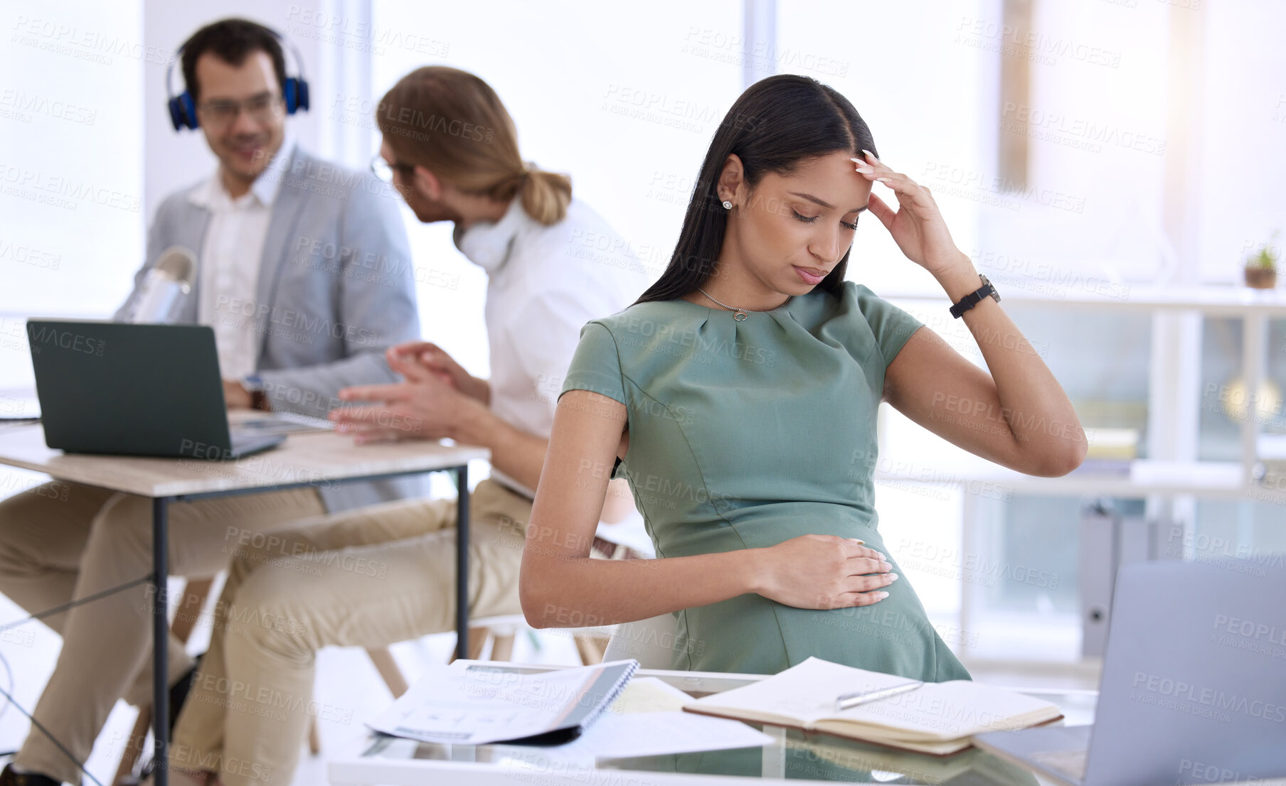 Buy stock photo Stress headache, pregnant woman in office and worry at desk, laptop and small business research online. Pregnancy, exhausted businesswoman and anxiety, overtime on report for startup design company.