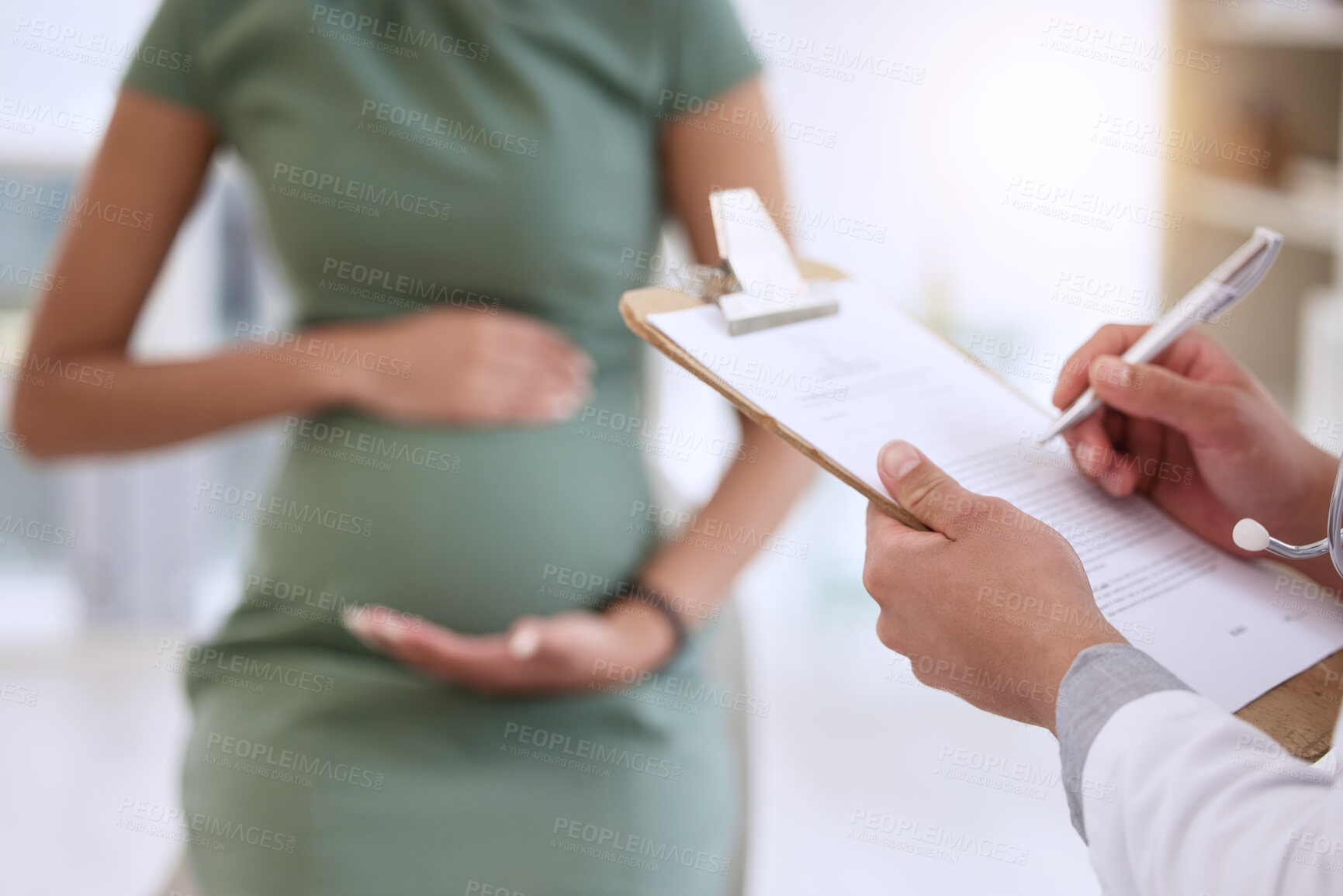 Buy stock photo Hands, doctor and writing on clipboard with pregnant woman for growth, health or development in clinic. Person, healthcare consulting and patient with notes, checklist or medical report for pregnancy