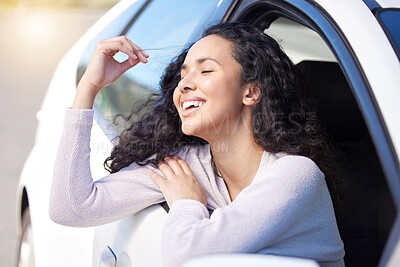 Buy stock photo Woman, happy and wind by window in car for travel, transportation and freedom in summer for journey on vacation. Smile, female person and relax in vehicle, sunshine and adventure to destination