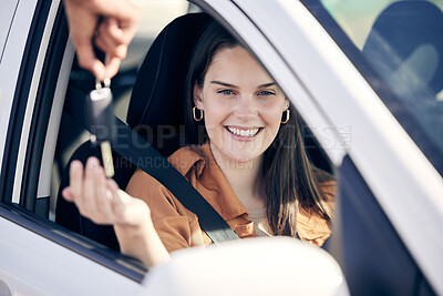 Buy stock photo Shot of a person handing a woman the keys to her new car outside