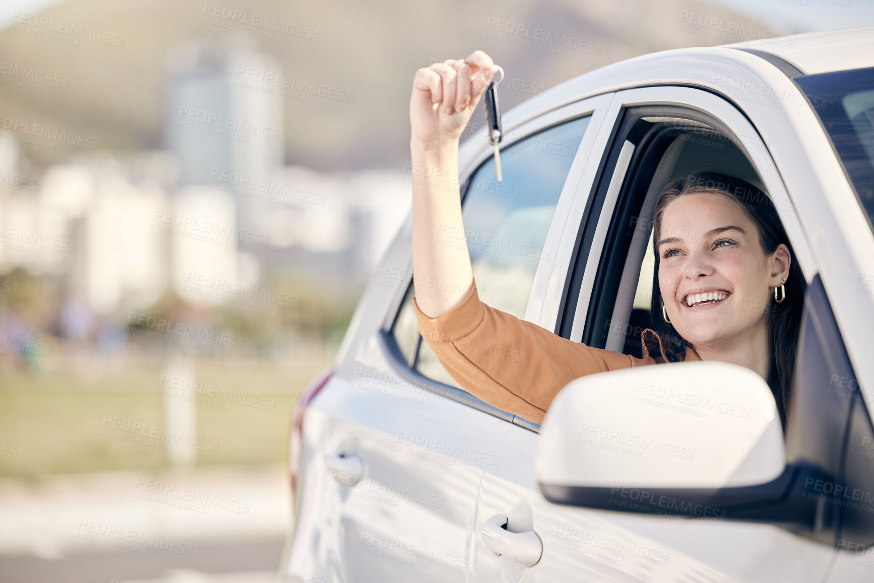 Buy stock photo Shot of a woman holding the keys to her new car outside