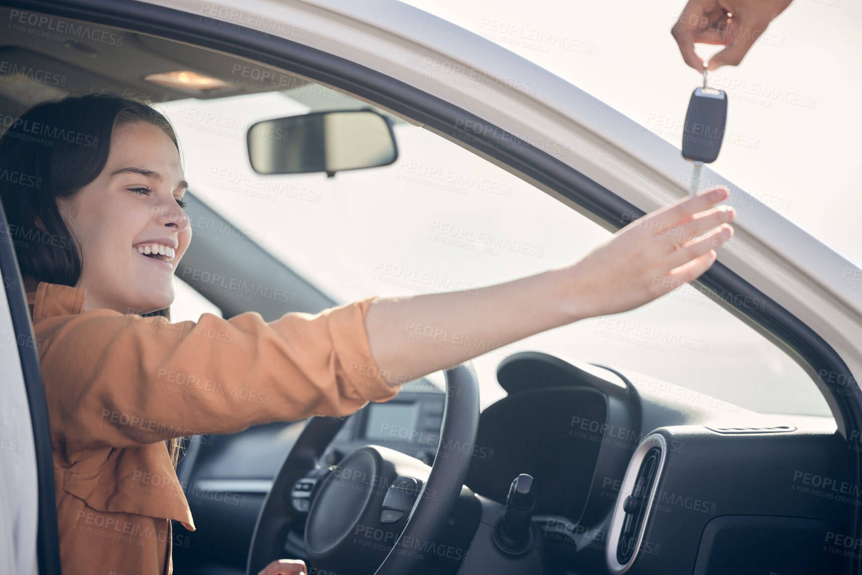 Buy stock photo Shot of a person handing a woman the keys to her new car outside