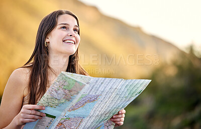 Buy stock photo Shot of a young woman holding a map while out exploring