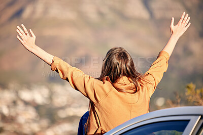 Buy stock photo Shot of a young woman out on a road trip