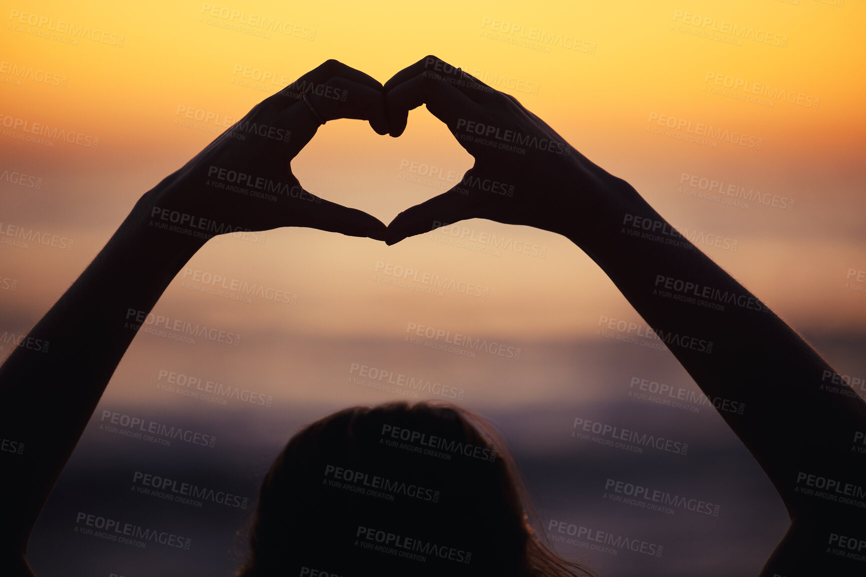 Buy stock photo Woman, heart hand and shadow at sunset at beach and ocean with peace and zen hands sign. Silhouette, nature and sea on a vacation with calm meditation and love emoji gesture outdoor at sunrise