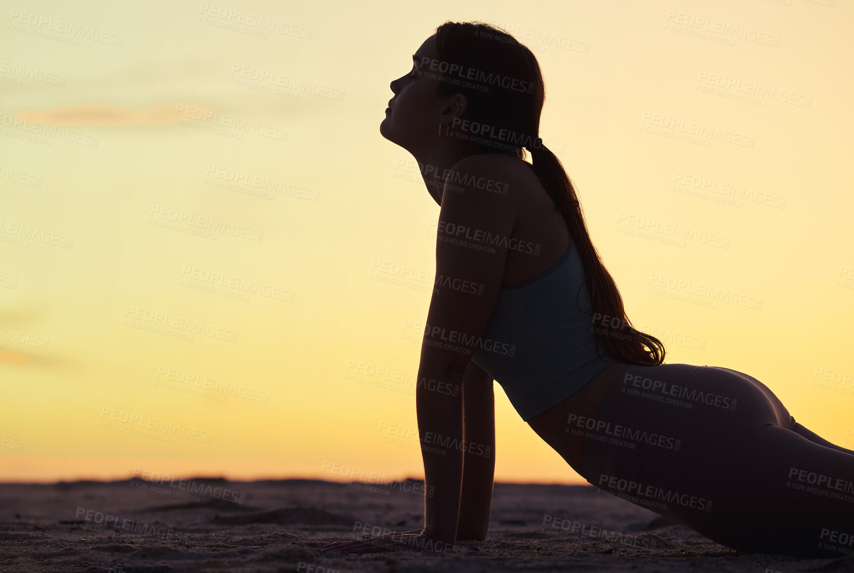 Buy stock photo Woman, stretching and silhouette at sunset on beach for yoga, exercise and workout with peace. Healthy, fitness and girl breathing in summer with holistic training for wellness, zen and meditation