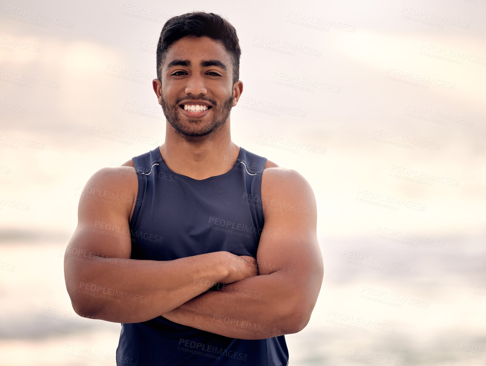 Buy stock photo Portrait, arms crossed and man for beach fitness, muscle and strong with biceps, health and wellness outdoor. Athlete, sport and training in nature with confidence, endurance and workout by the ocean