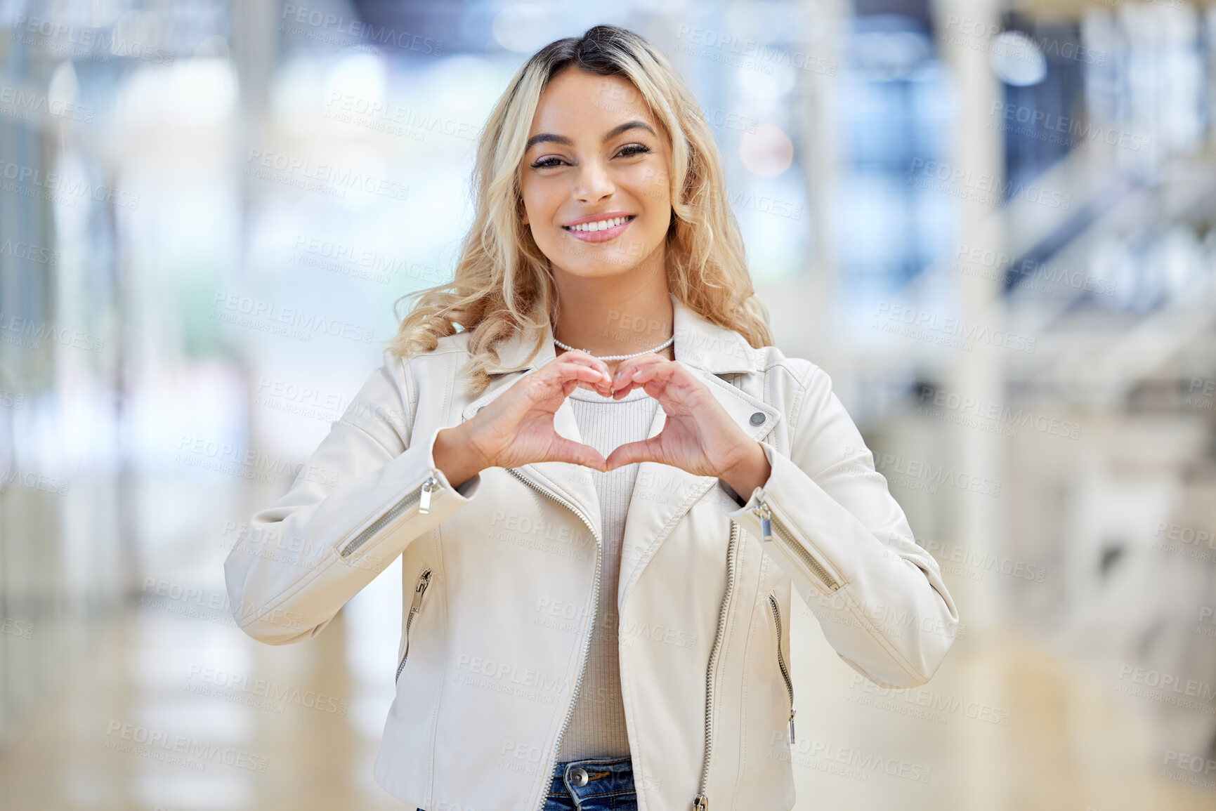 Buy stock photo Smile, heart and portrait of woman with hands for love, care or feedback review at shopping mall. Fingers, support and gesture for peace, gratitude and trust with promotion of charity donation emoji