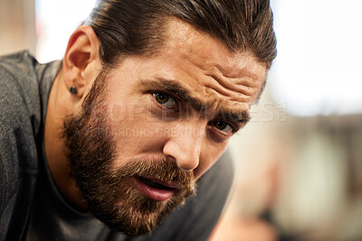 Buy stock photo Tired, portrait and a man in the gym with a break from fitness, breathing and training. Rest, health and face of a person with fatigue after a workout, exercise and catching breath after sports