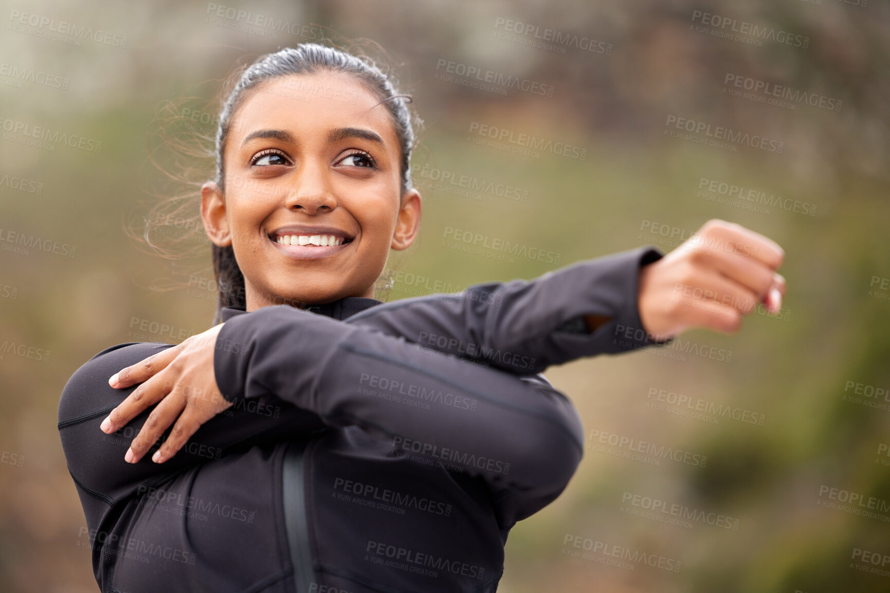 Buy stock photo Fitness, smile and woman stretching arms in park for running exercise, wellness or marathon training in nature. Sports, cardio and Indian girl runner in forest with body, warm up and routine workout