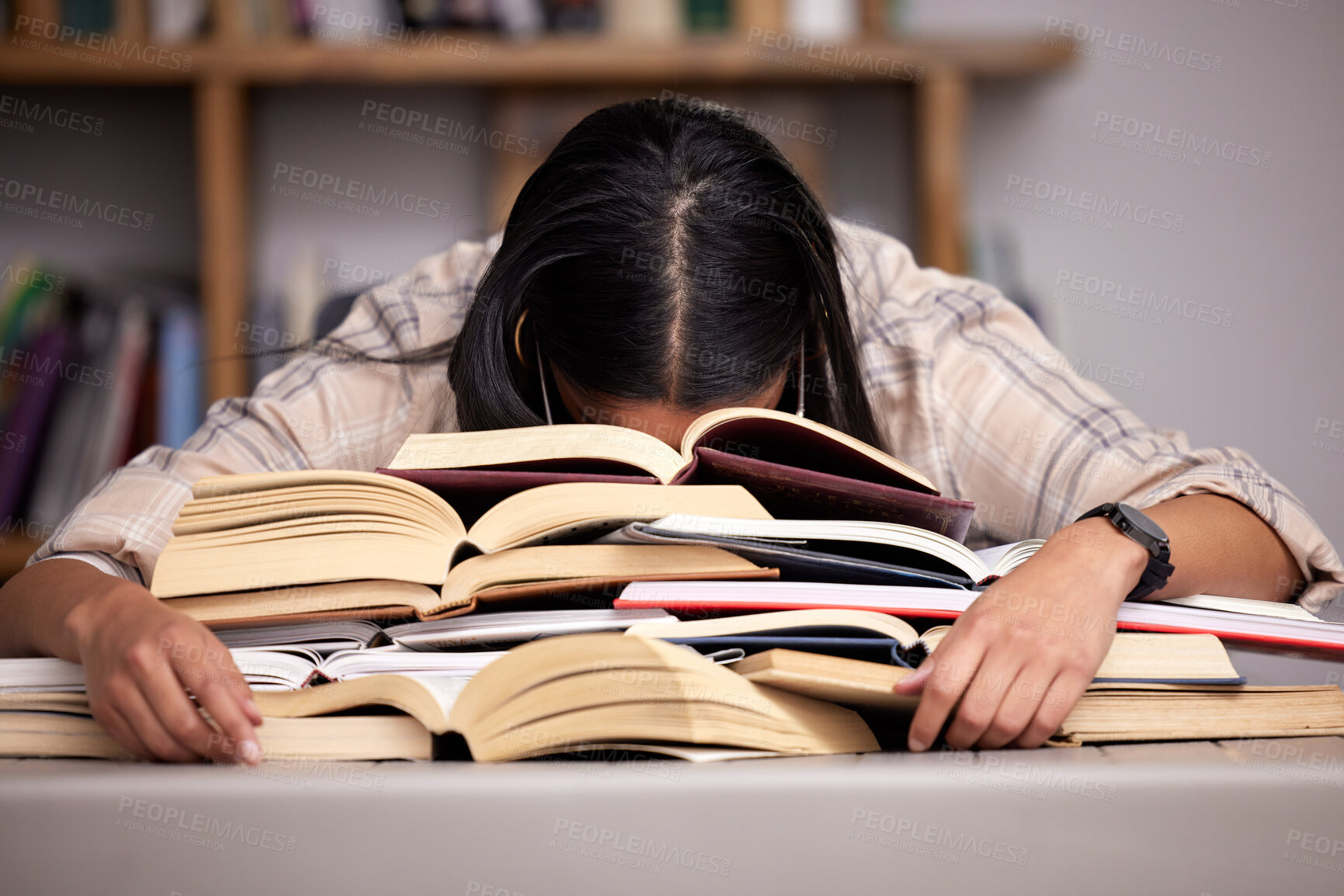 Buy stock photo Study books, fatigue and woman student at desk with textbook for test feeling overworked. Stress, female person and home studying for university exam and course with burnout and sleeping in a house