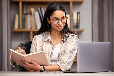 Buy stock photo Laptop, notebook and learning with a student woman in a university library to study for a final exam. Technology, education and diary with a young female college pupil reading research material