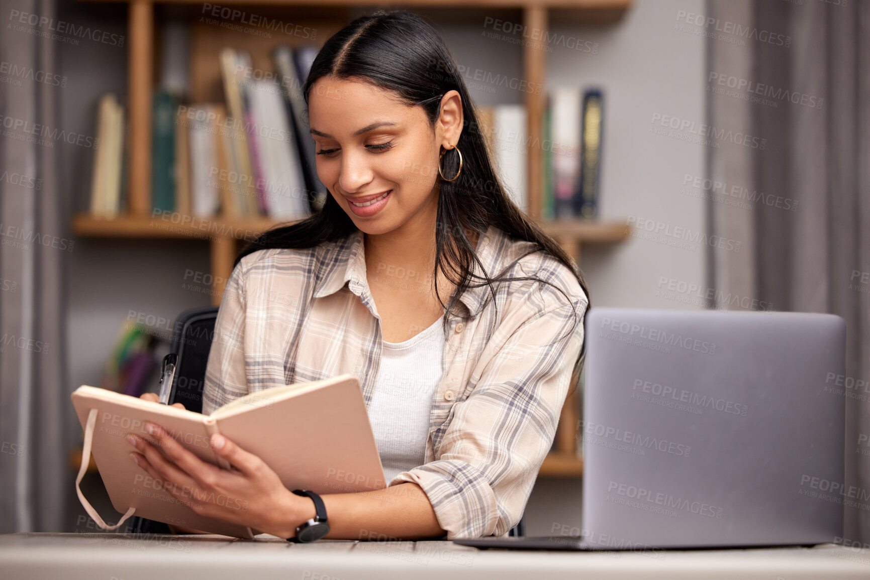 Buy stock photo Laptop, book and education with a student woman in a university library to study for a final exam or test. Technology, learning and journal with a young female college pupil reading research material