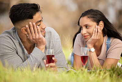 Buy stock photo Couple, glass and wine on grass for love with celebrate anniversary, alcohol and relax for picnic. Woman, man and happiness in nature with drink, smile and honeymoon or weekend date for relationship