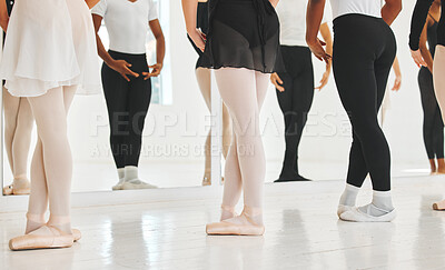 Buy stock photo Shot of a group of unrecognisable ballet dancers practicing their routine in a dance studio
