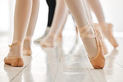 Buy stock photo Shot of a group of unrecognisable ballet dancers practicing their routine in a dance studio