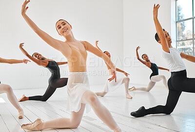 Buy stock photo Shot of a group of young ballet dancers practicing their routine in a dance studio