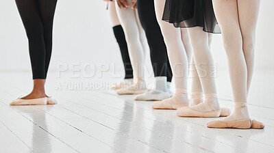 Buy stock photo Shot of a group of unrecognisable ballet dancers practicing their routine in a dance studio