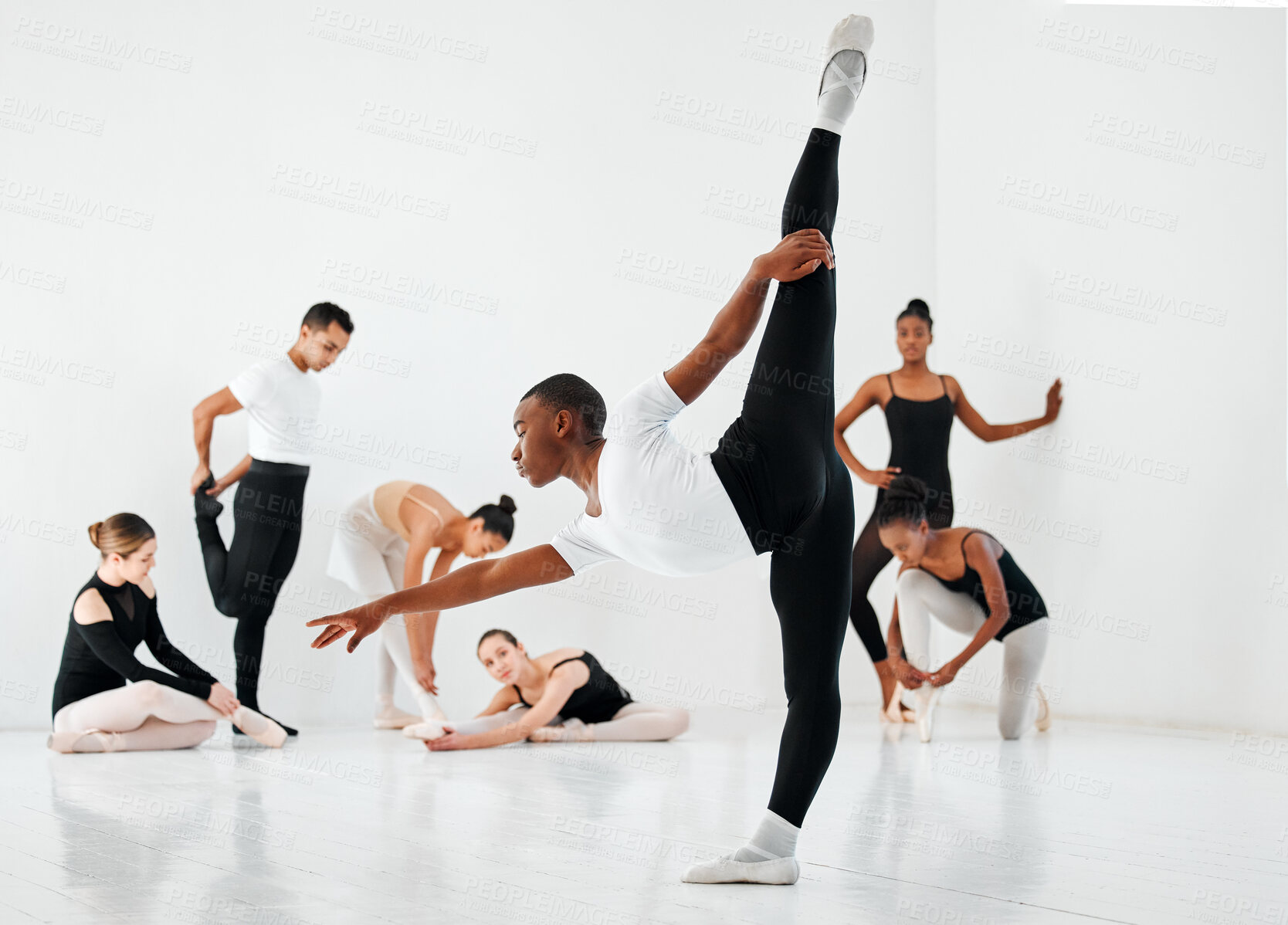 Buy stock photo Ballet, dance and group warm up with practice stretch for performance art, elegance or learning. Diversity, ballerina and students with training in class for dancing academy, teamwork and balance